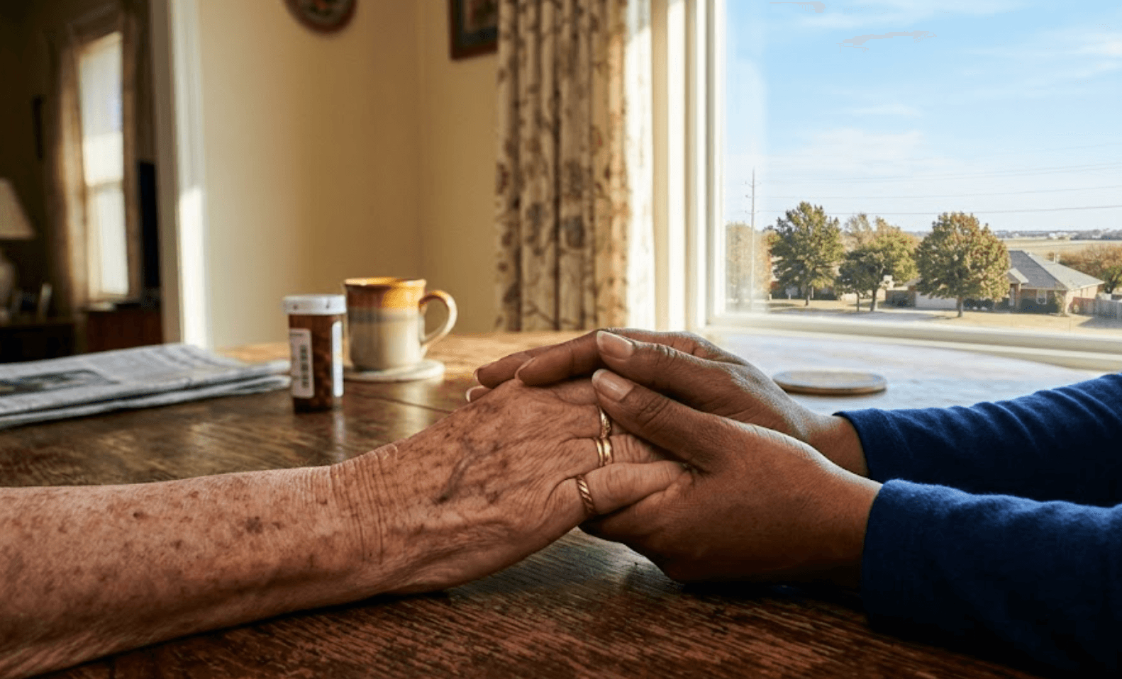 XtraMiles caregiver holding hands with elderly client in Tulsa, Oklahoma